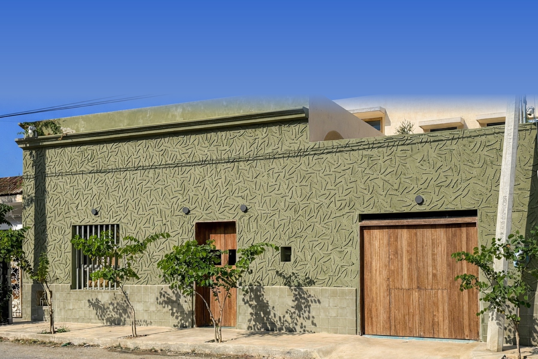 Casa Querida exterior — olive green facade, Mérida